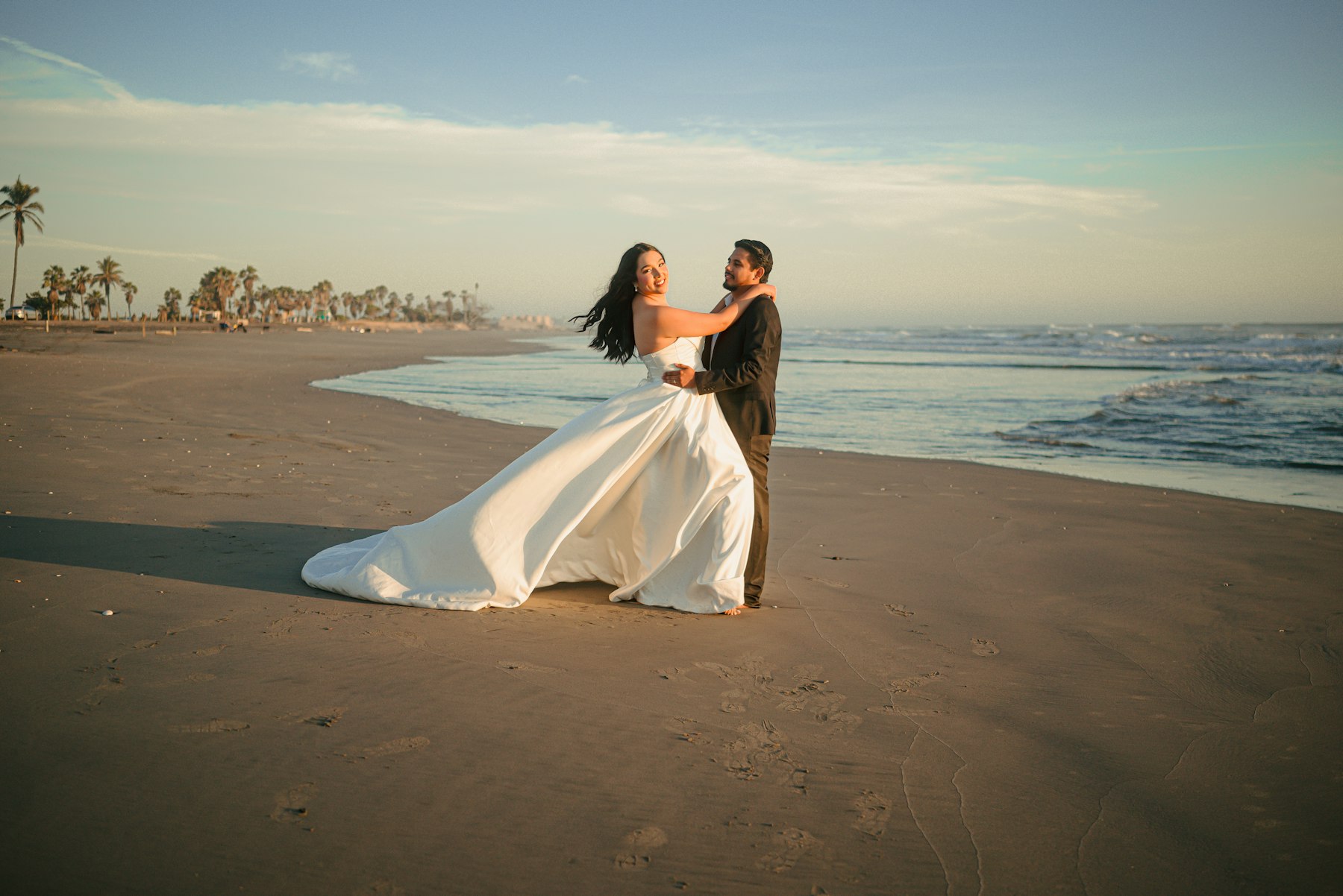 Beach wedding ceremony with white chairs and turquoise ocean view